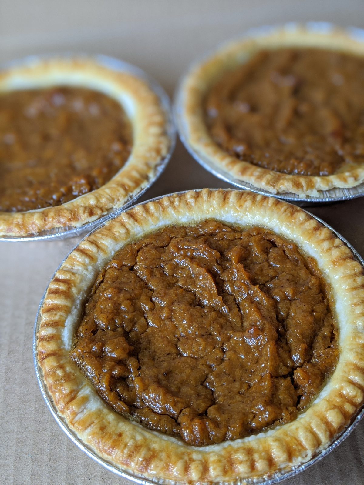 Sweet potato pies cooling in tins