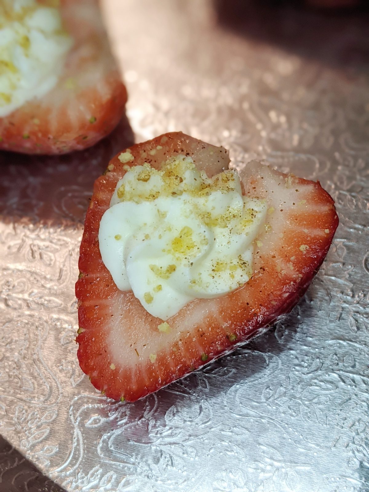 Strawberry half filled with cheesecake cream
