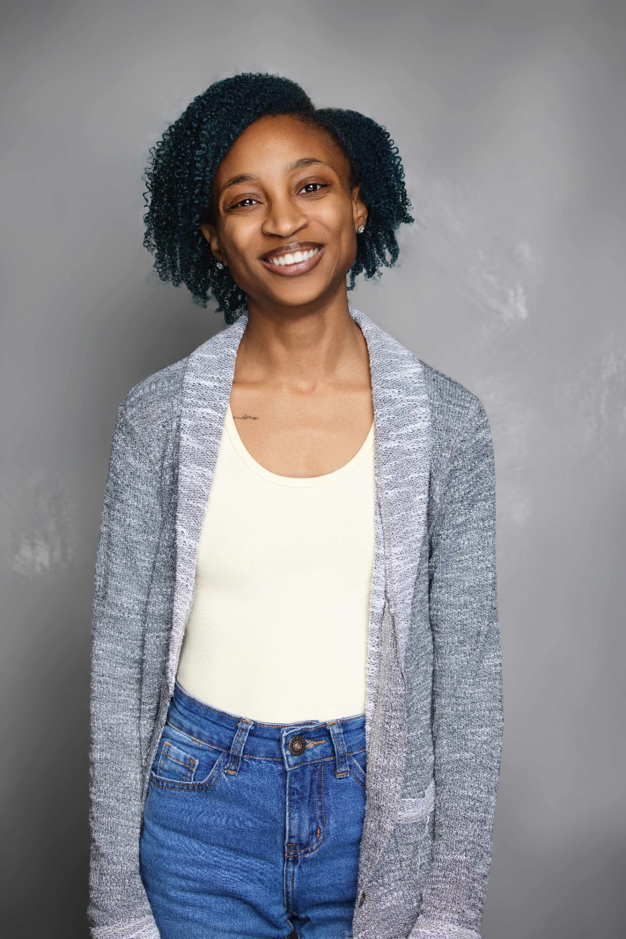 Chef Sa'Renn standing, hands in her pockets, smiling