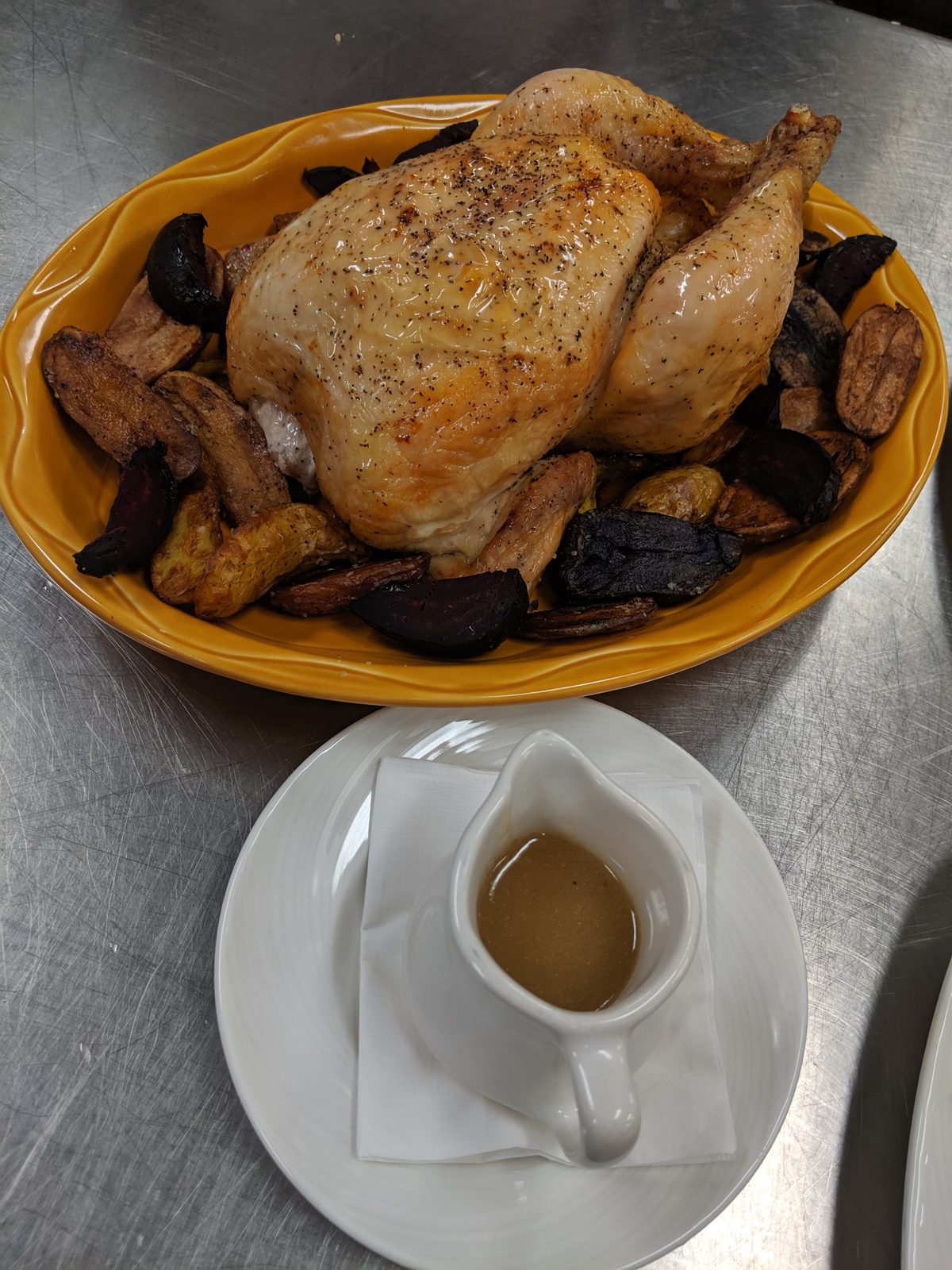 Whole roast chicken with mushrooms, made in Chef Sa'Renn's kitchen